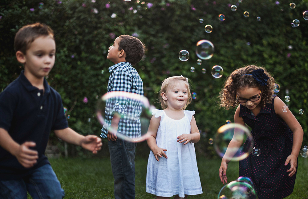 children learn in a funny way about science with soap bubbles